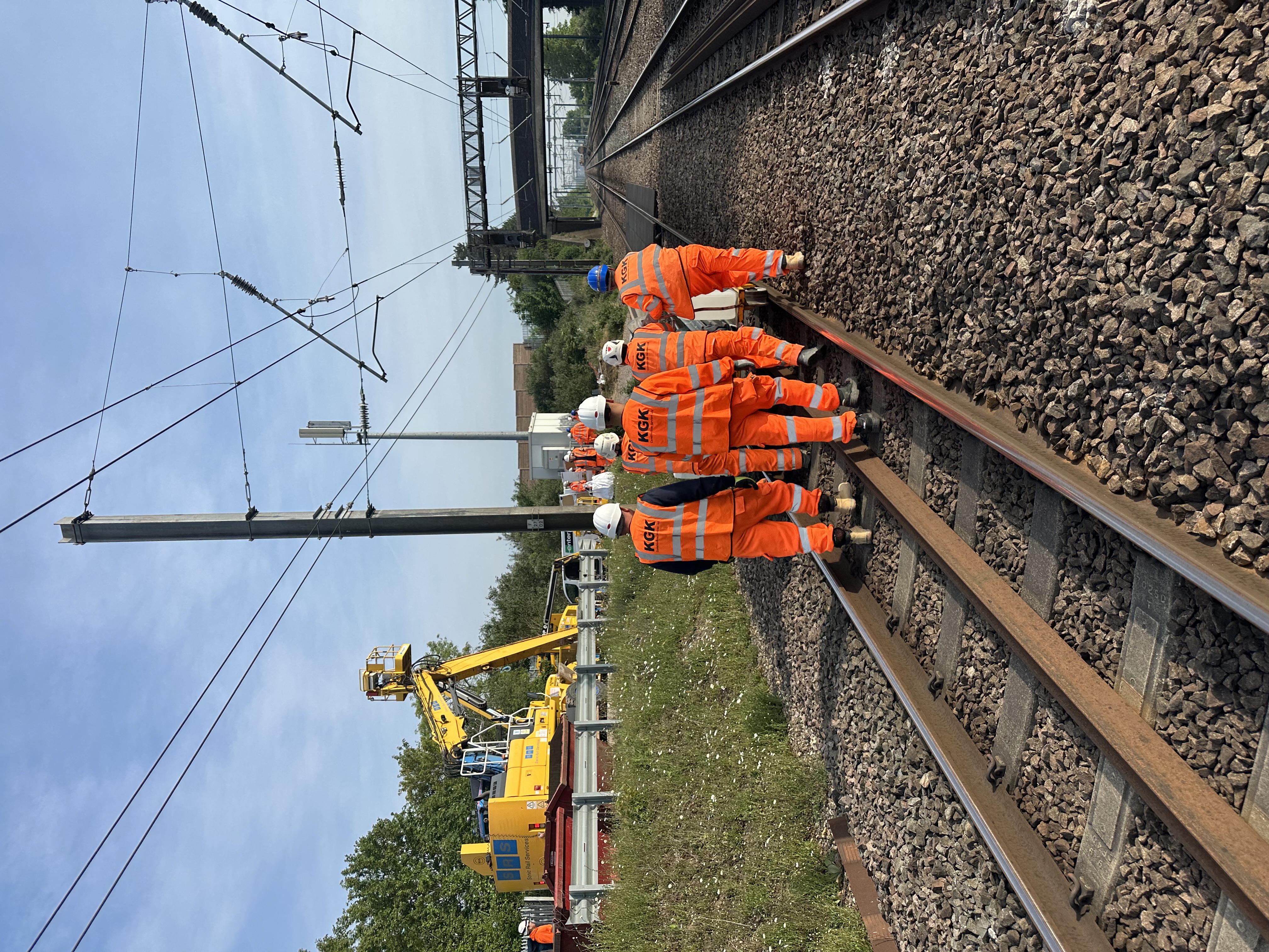 KGK operative walking Network Rail trackside
