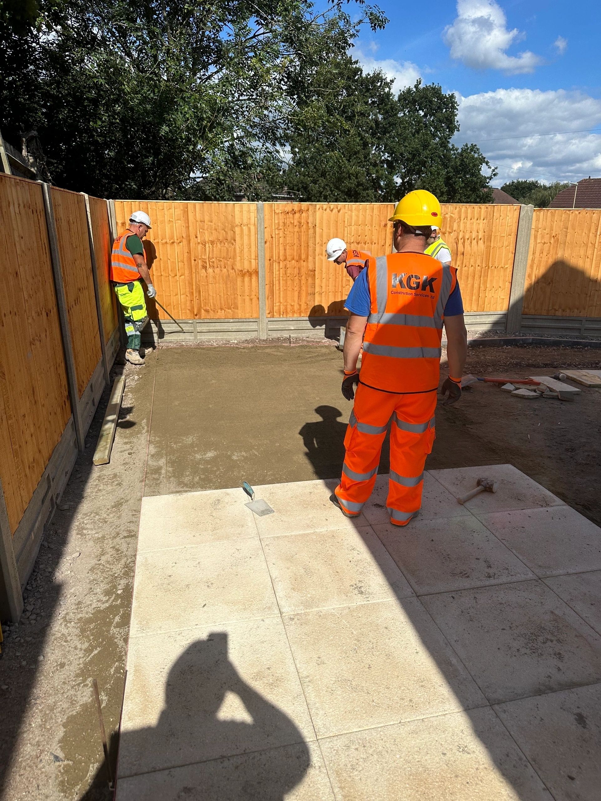 KGK workers on concrete foundation